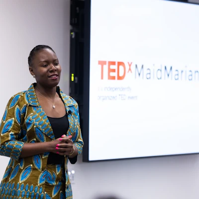 Magdalene Usikaro speaking at a TEDx event